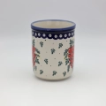 Duży ceramiczny pojemnik na przybory kuchenne z ręcznie malowanym motywem dekoracyjnym.
