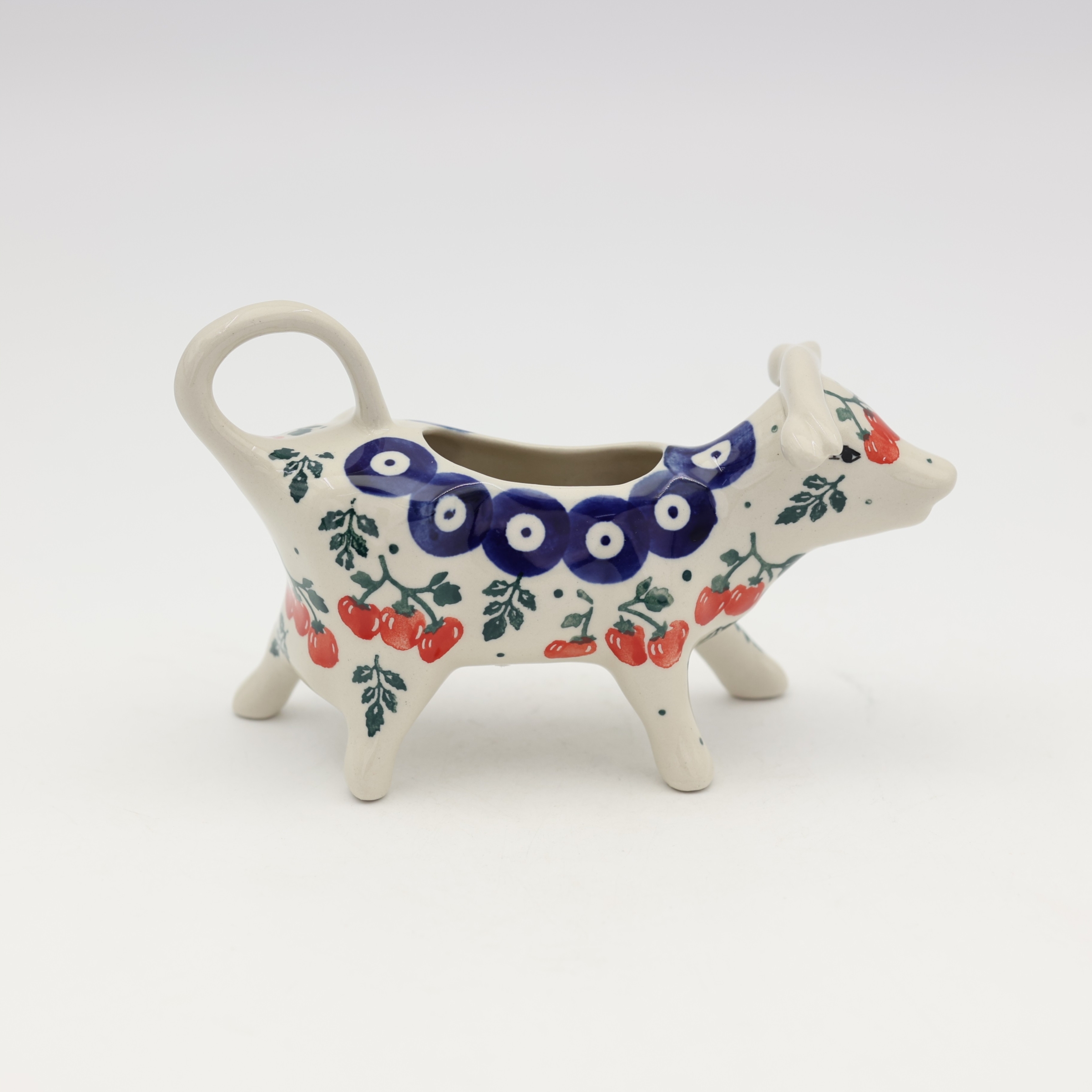 Ceramiczny mlecznik krowa z Bolesławca.