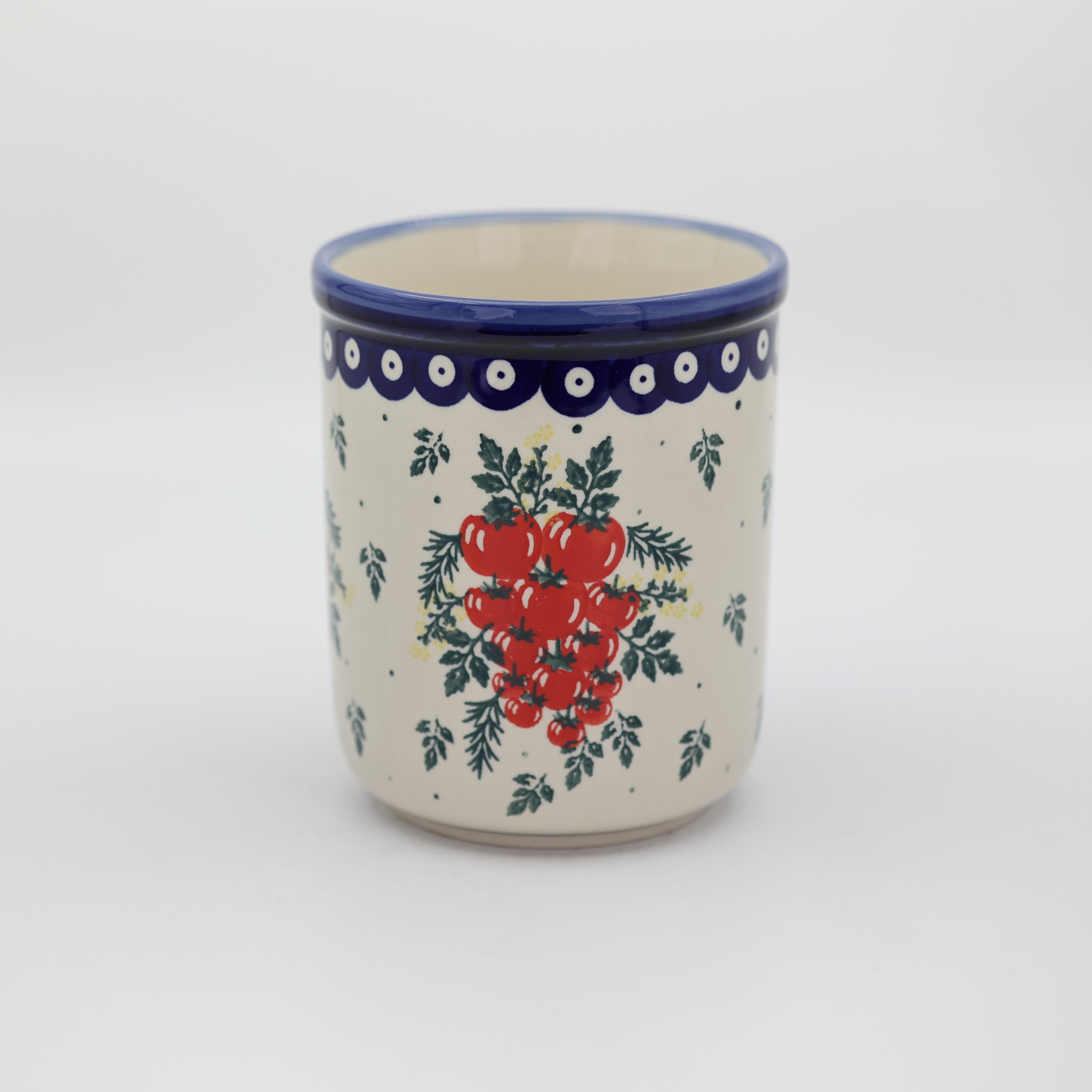 Duży ceramiczny pojemnik na przybory kuchenne z ręcznie malowanym motywem dekoracyjnym.